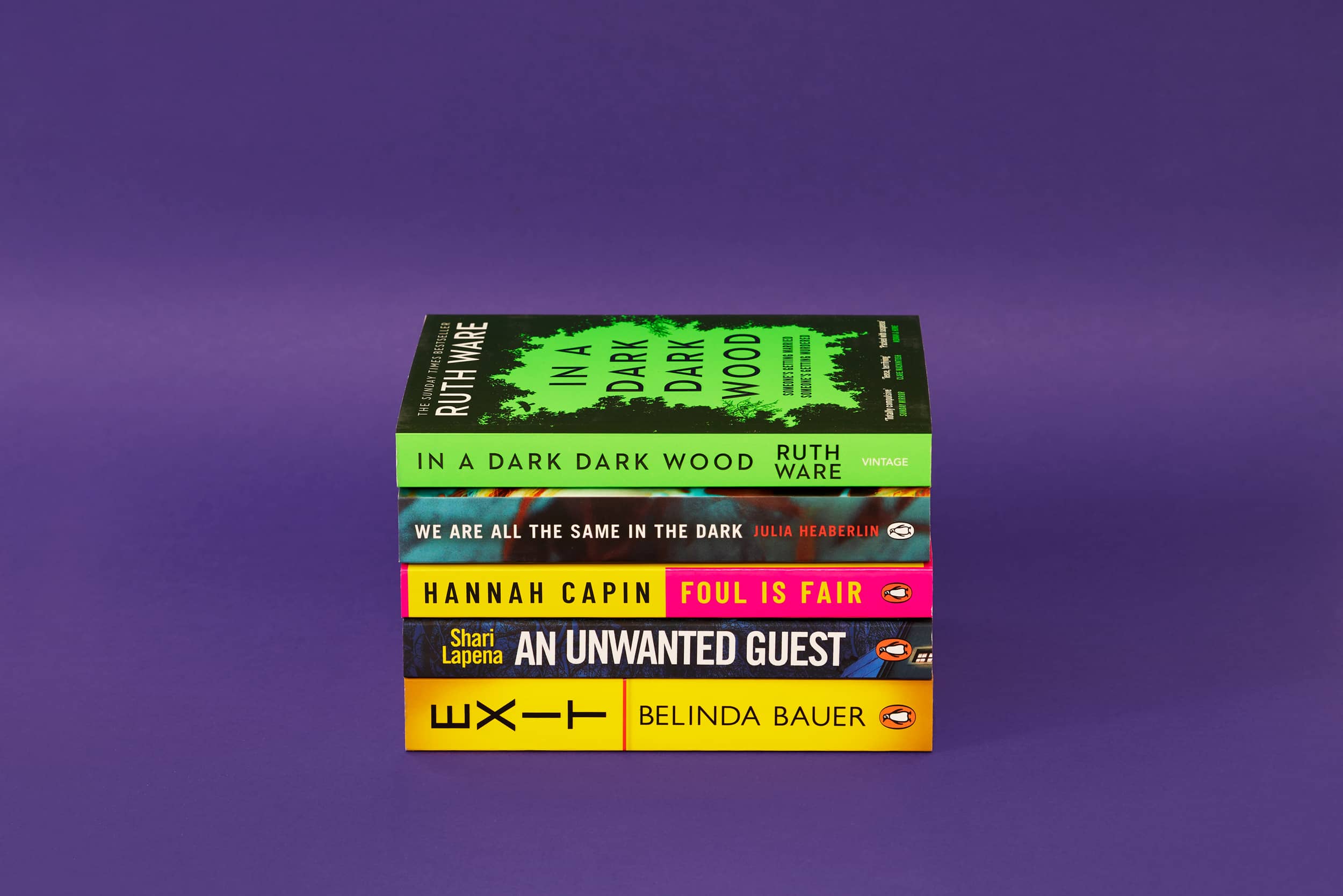 Page Turners All Nighter Bundle on a purple background. Bundle costs £20 and consists of In a Dark Dark Wood, We Are All the Same in the Dark, Foul is Fair, An Unwanted Guest and Exit.