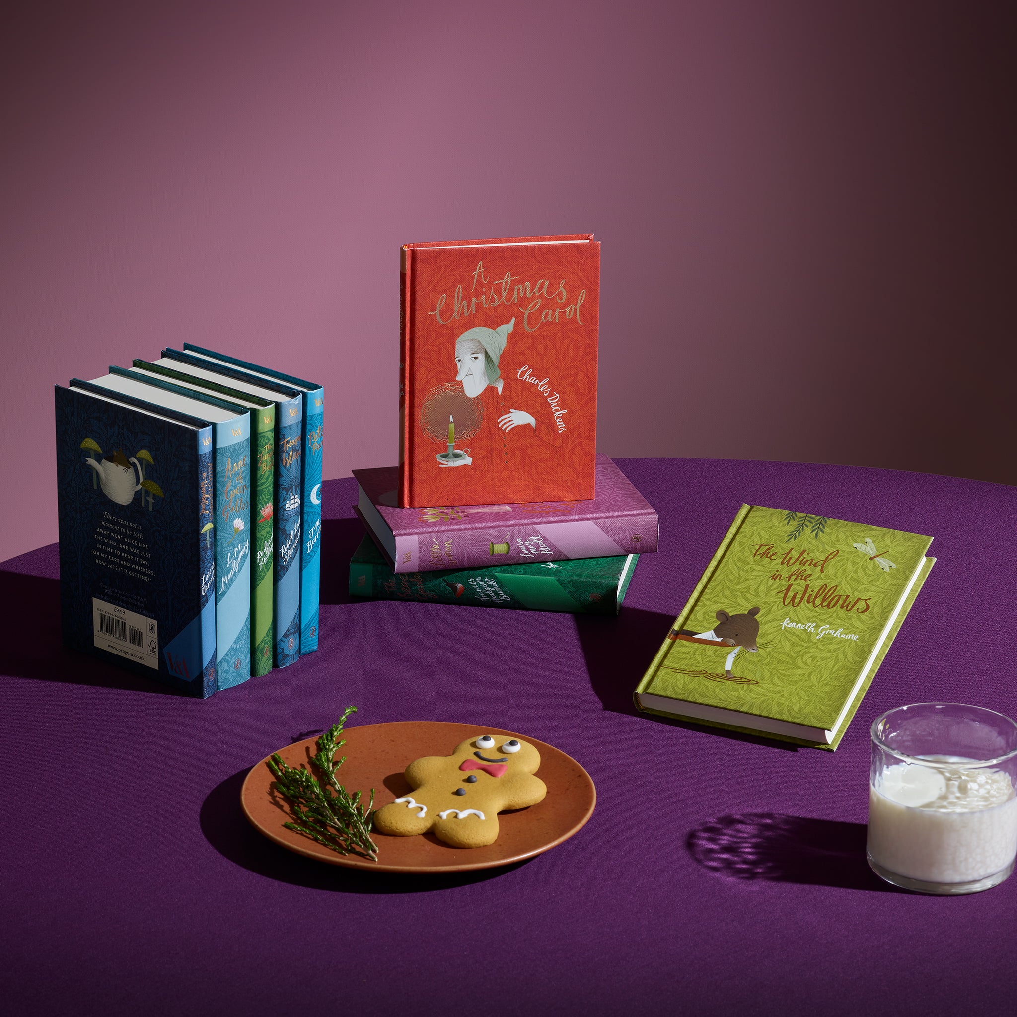 V&A Children's Classics on a purple clothed table with milk and a gingerbread man