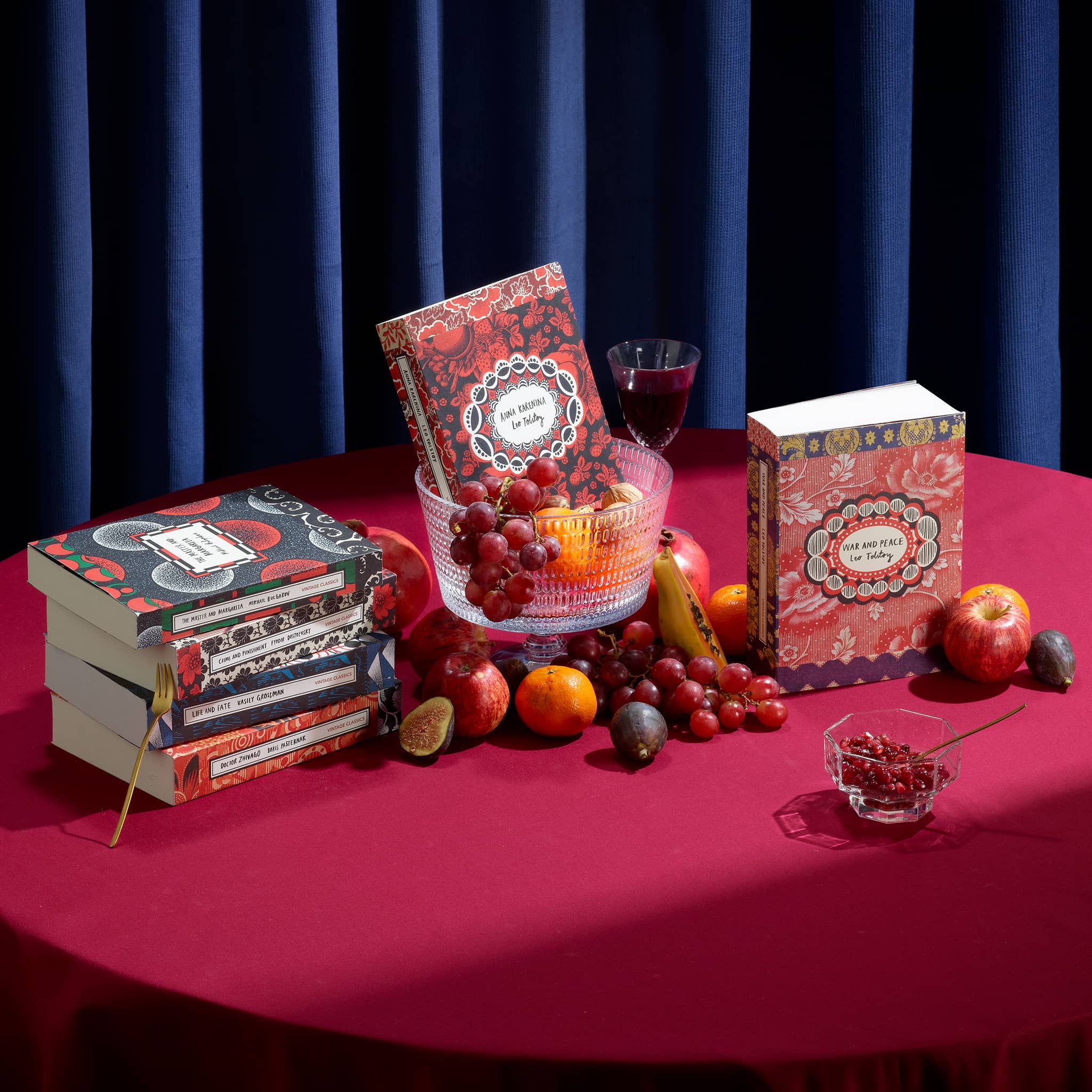 Vintage Russian Classics on a red clothed table with fruits