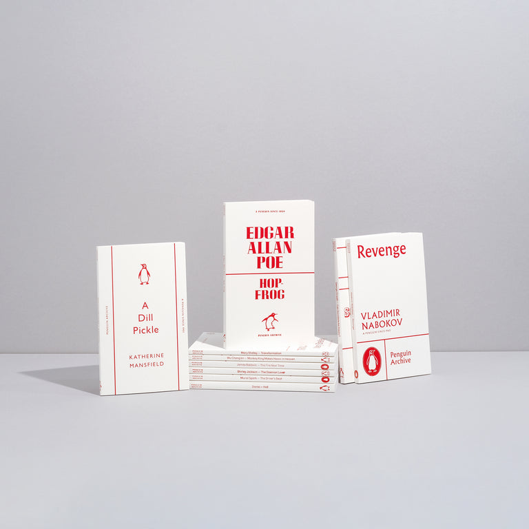A collection of small white paperbacks with red text and images on the covers from the Penguin Archive Collection